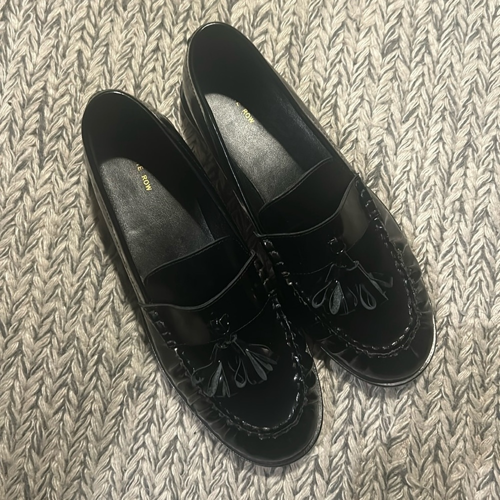 The Row Black Patent Leather Tassel Loafers